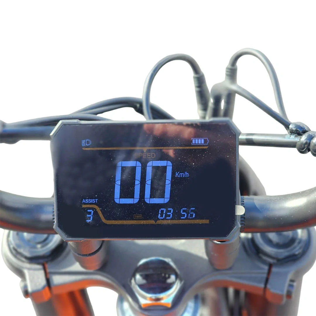 Digital speedometer on a motorcycle handlebar with blue display