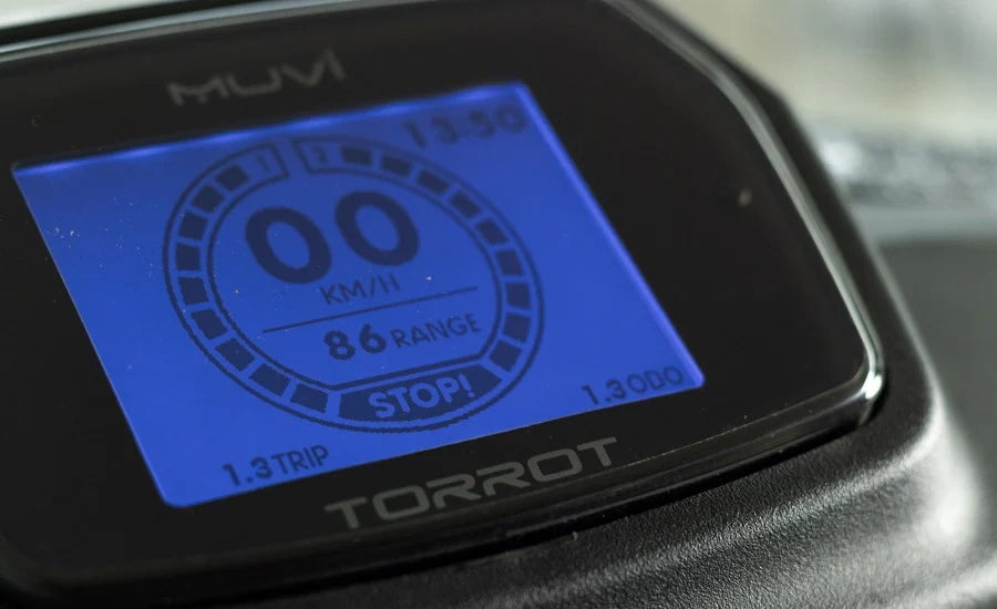 Digital display of a Torrot device with blue screen and black casing.