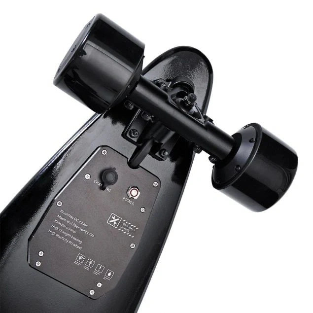Close-up of a black electric skateboard with visible components on a white background