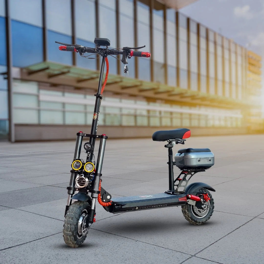 Electric scooter with a seat on a pavement in front of a modern building.