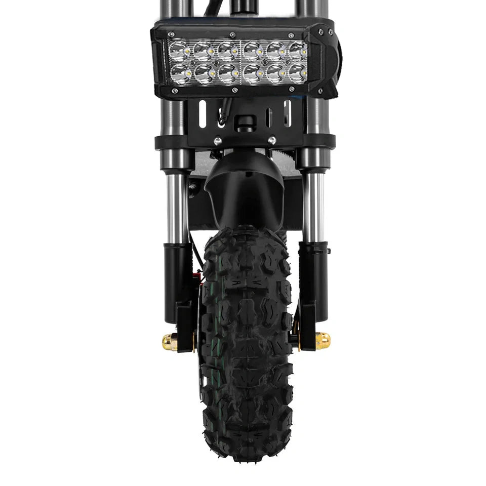 Close-up of a motorcycle front wheel with a large LED light on a white background