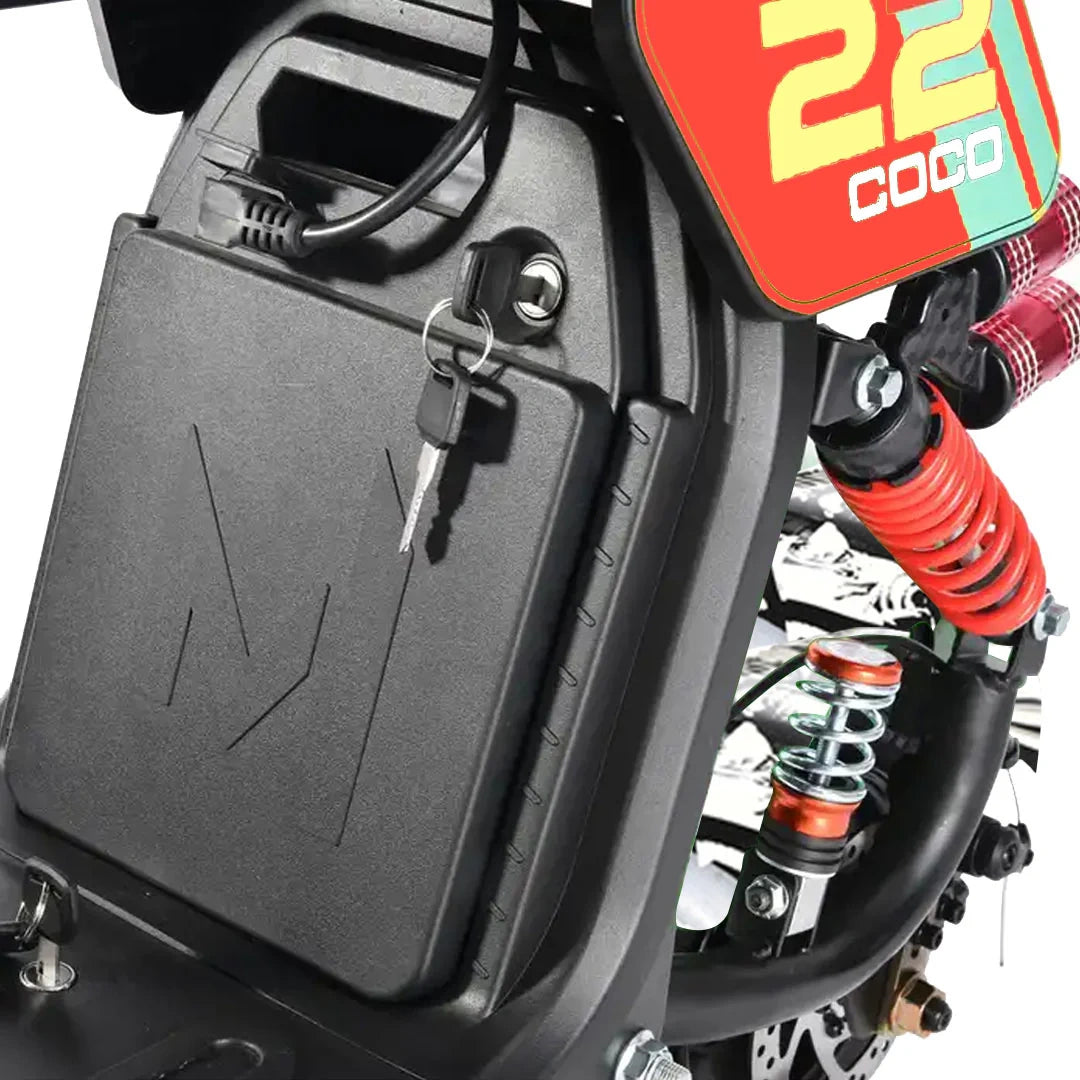 Close-up of a motorcycle with a key in the ignition and '22 COOQ' branding.