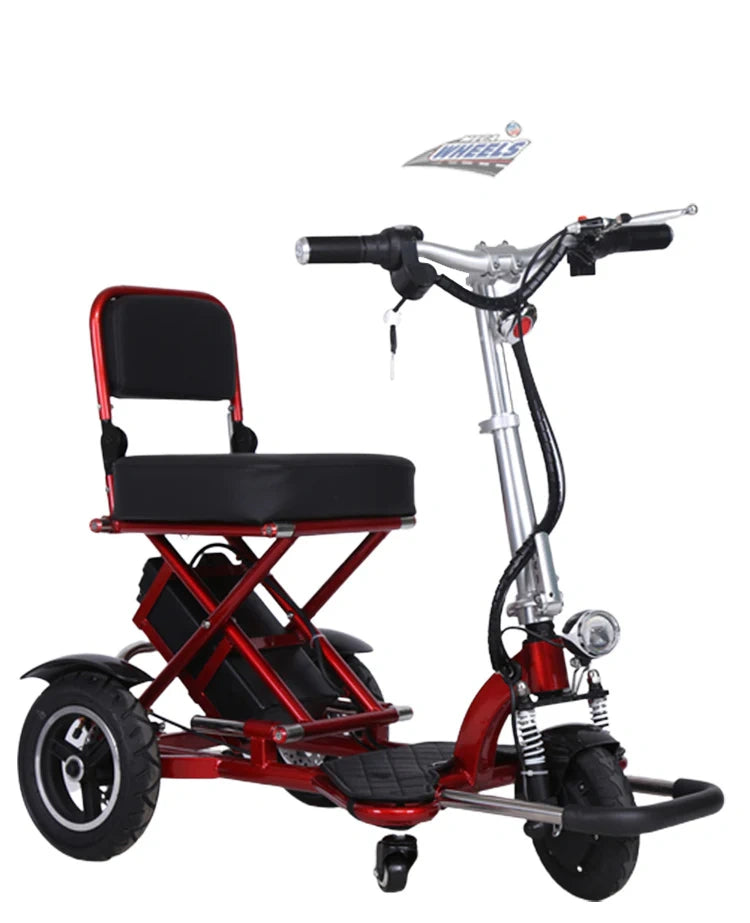 Red and black three-wheeled mobility scooter with a seat on a white background