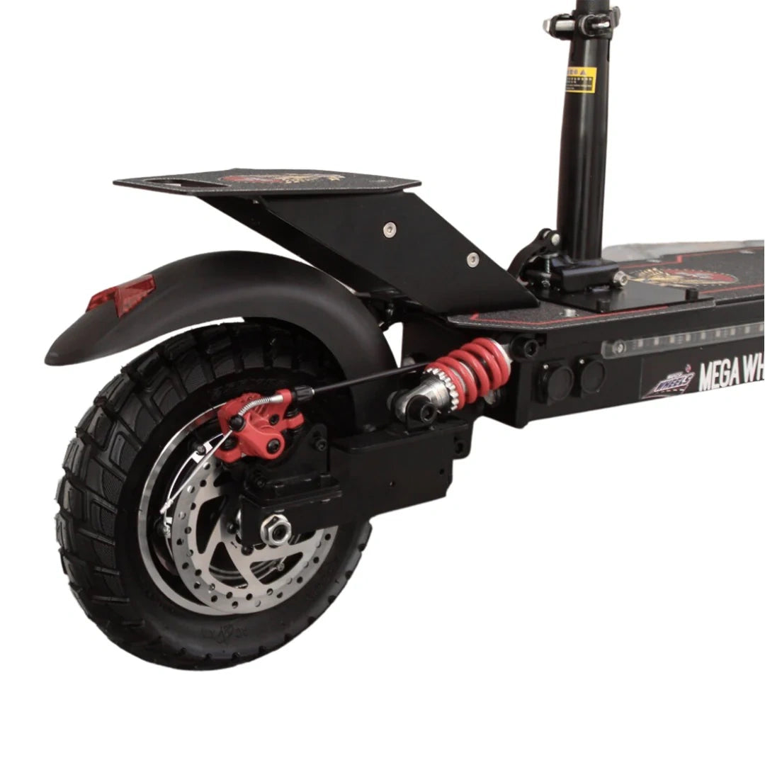 Close-up of a scooter's wheel and suspension system on a white background