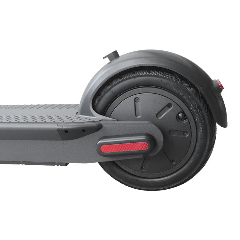 Close-up of a scooter wheel with red brake lever on a white background