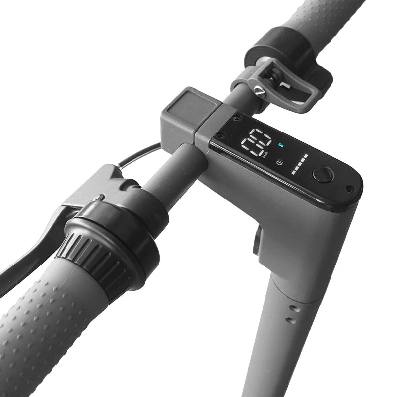 Close-up of a bicycle handlebar with digital display and charging port on a white background