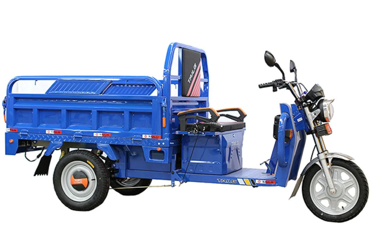 Blue electric tricycle with cargo bed on a white background