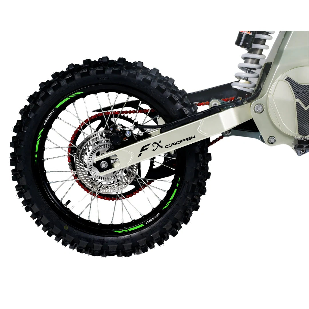 Close-up of a dirt bike wheel with FX Racing branding on a white background