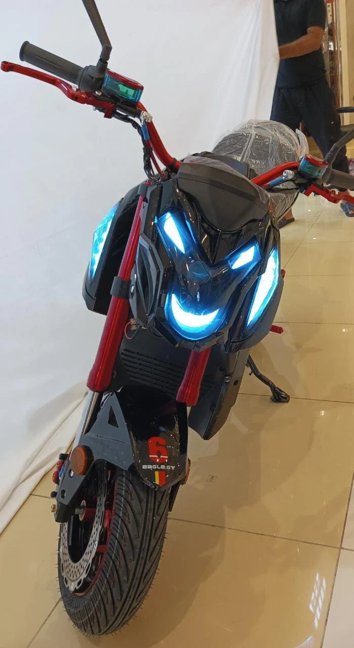 Motorcycle with glowing blue headlights on a reflective floor