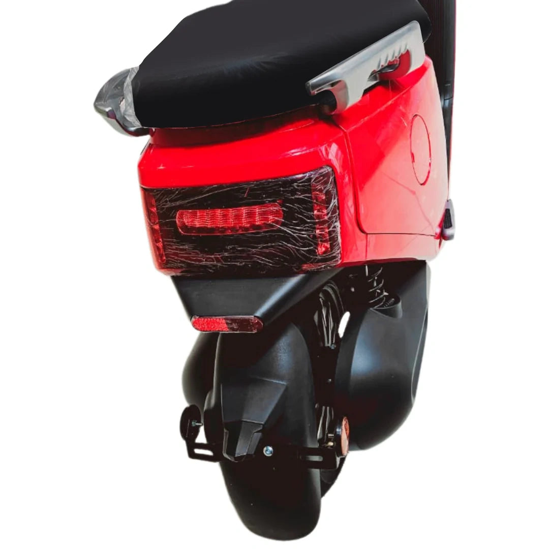 Red and black scooter on a white background