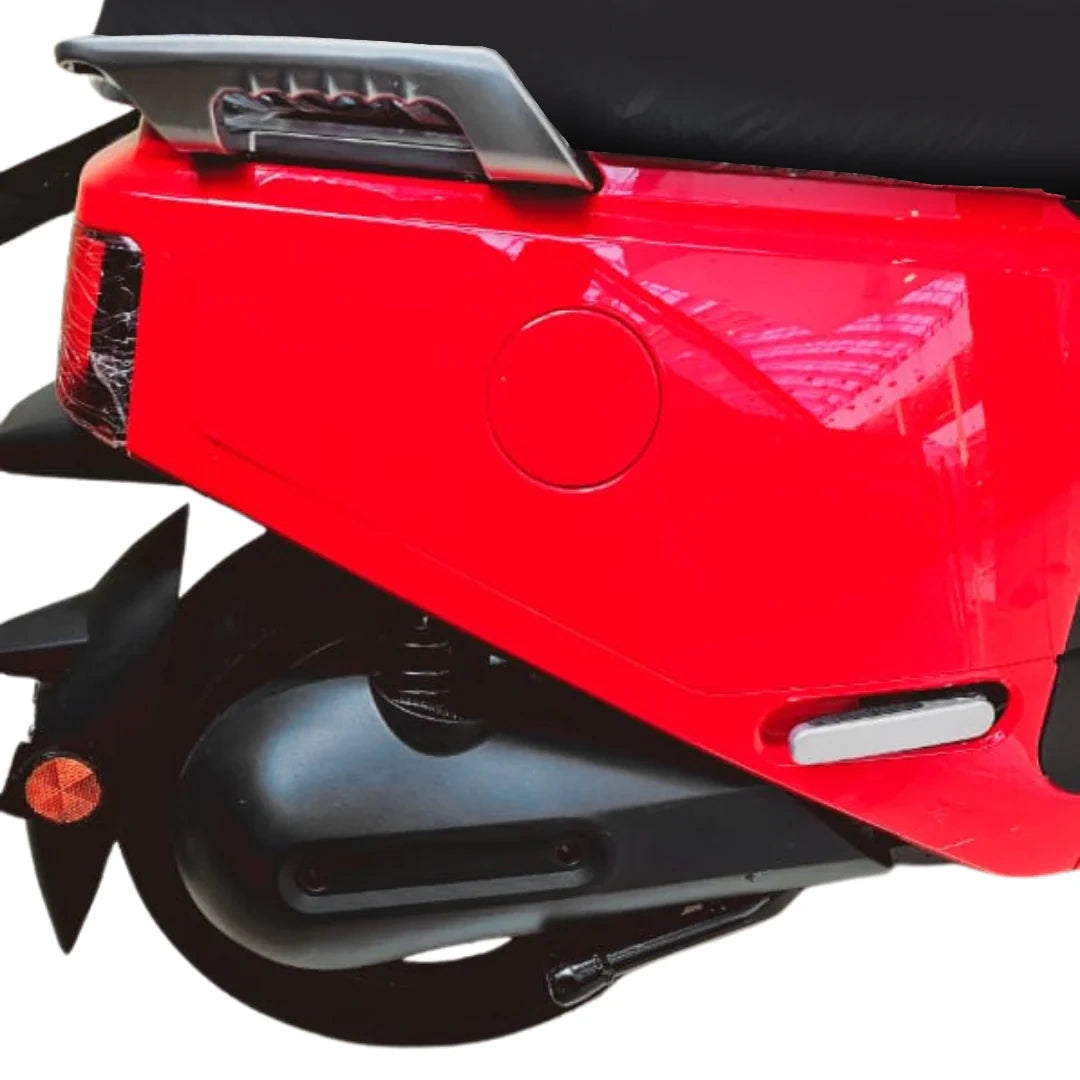 Close-up of a red scooter's rear section on a white background