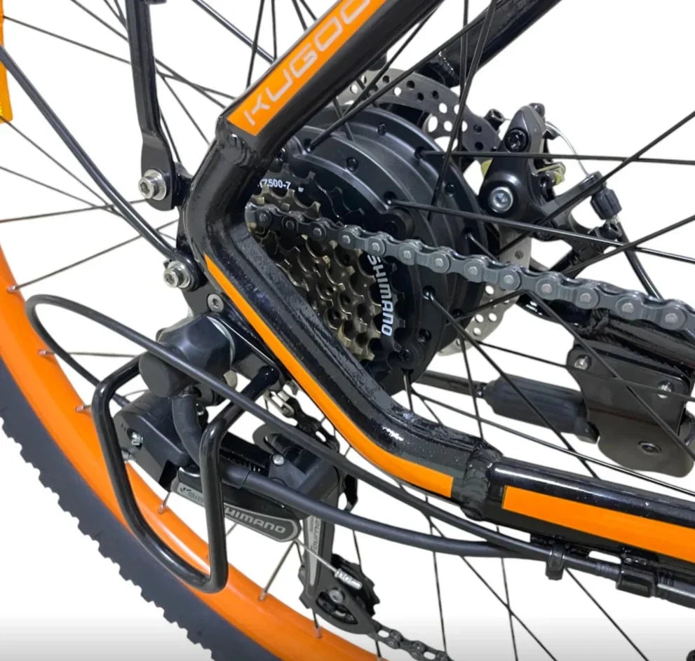 Close-up of a bicycle chain and gear system with 'Kubota' branding on a white background.