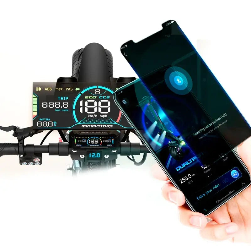 Motorcycle dashboard with digital display and a smartphone showing app interface.