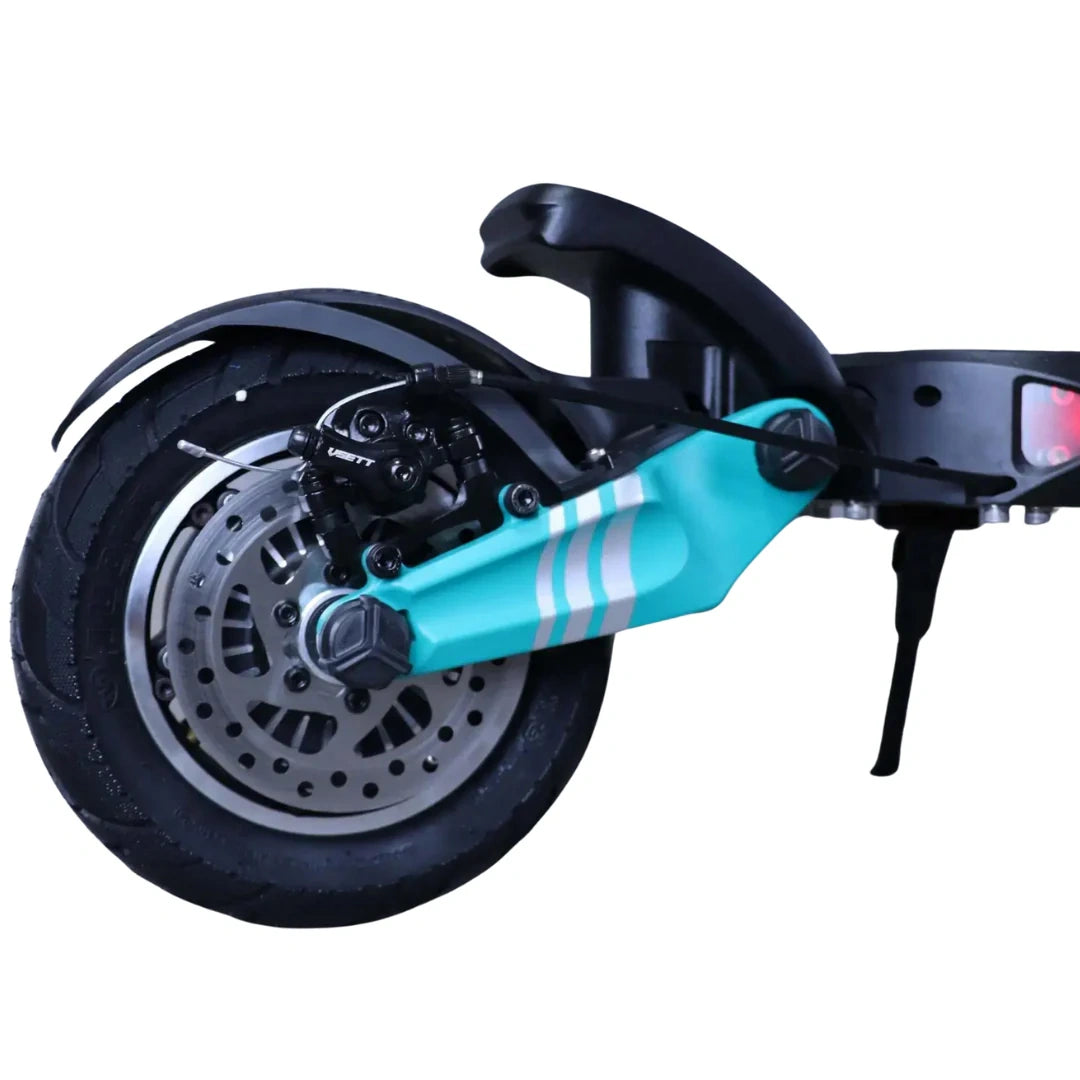 Close-up of a scooter's wheel and suspension system on a white background