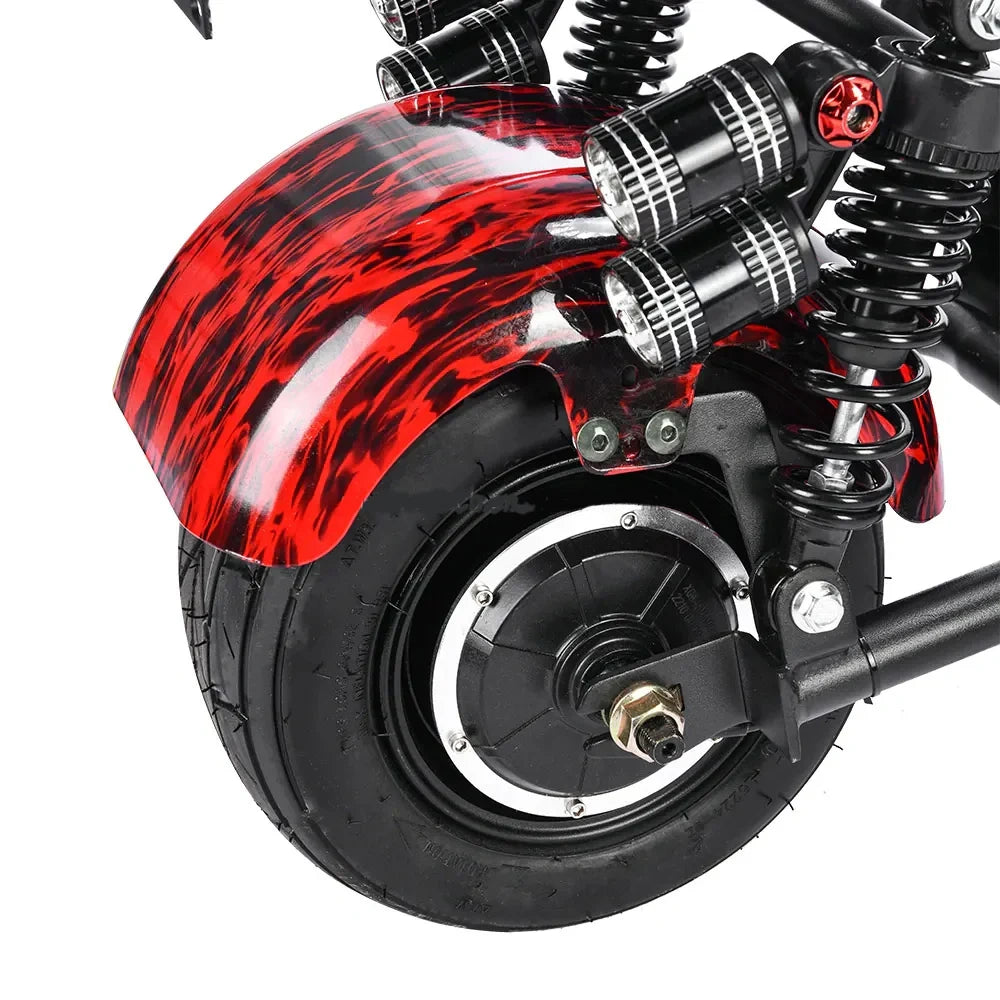 Close-up of a motorcycle wheel with red flame design on a white background