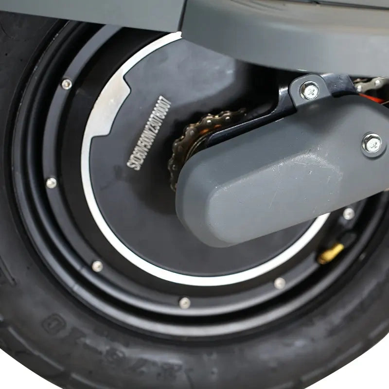 Close-up of a motorcycle wheel with chain and sprocket
