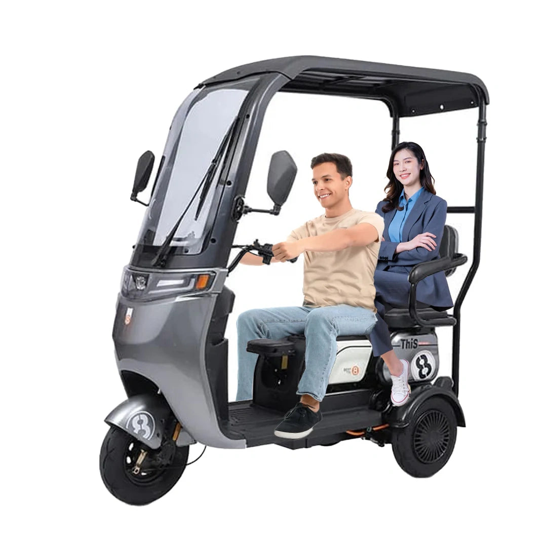 Two people riding in a three-wheeled electric vehicle on a white background