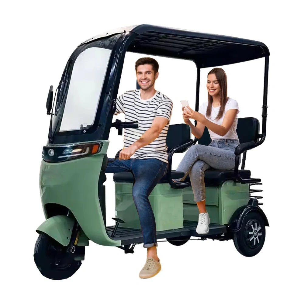 Two people sitting in a green electric rickshaw on a white background