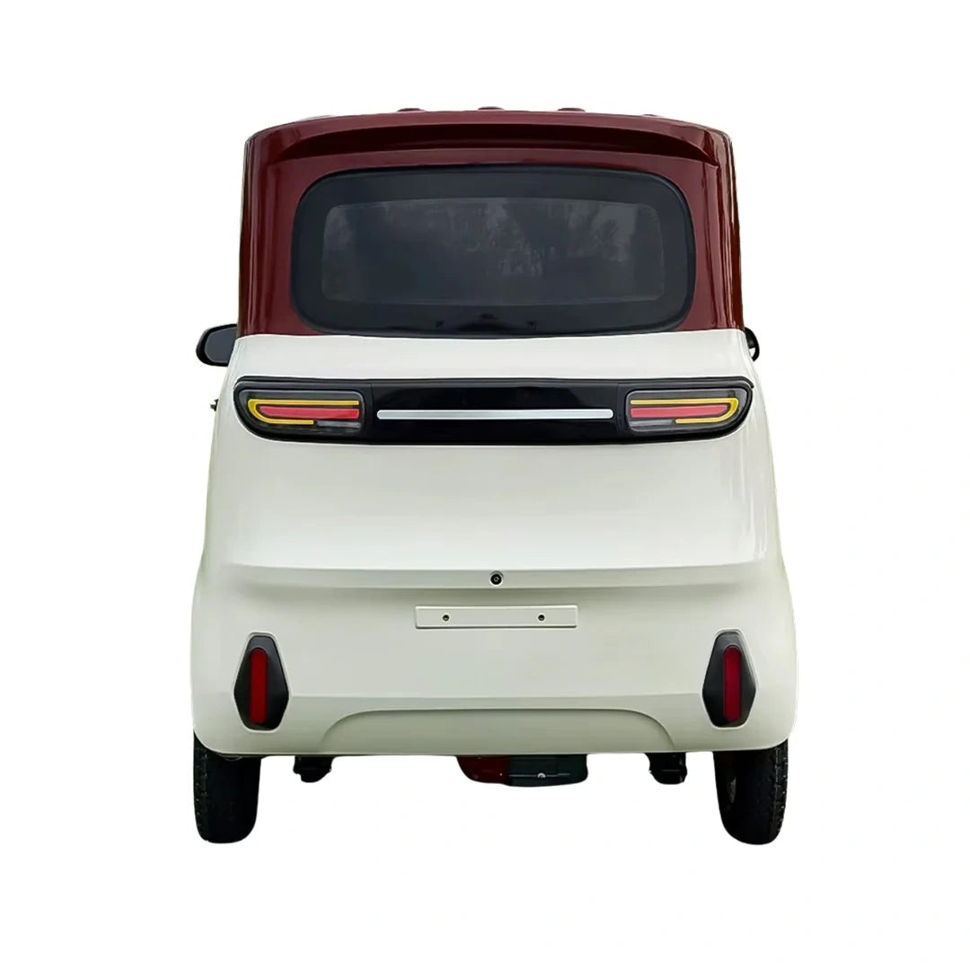 Back view of a small vehicle with a white body and red roof on a white background