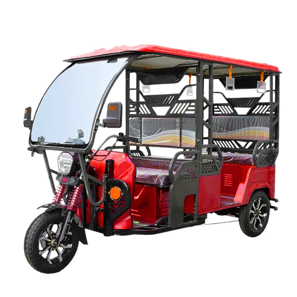 Red electric rickshaw on a white background