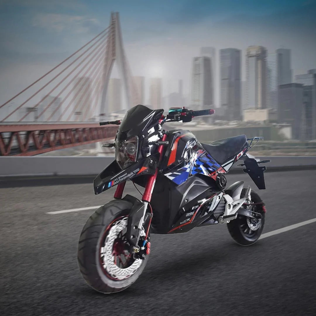 Motorcycle on a road with a cityscape and bridge in the background