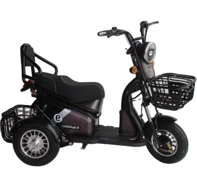 Black electric tricycle with a basket on a white background