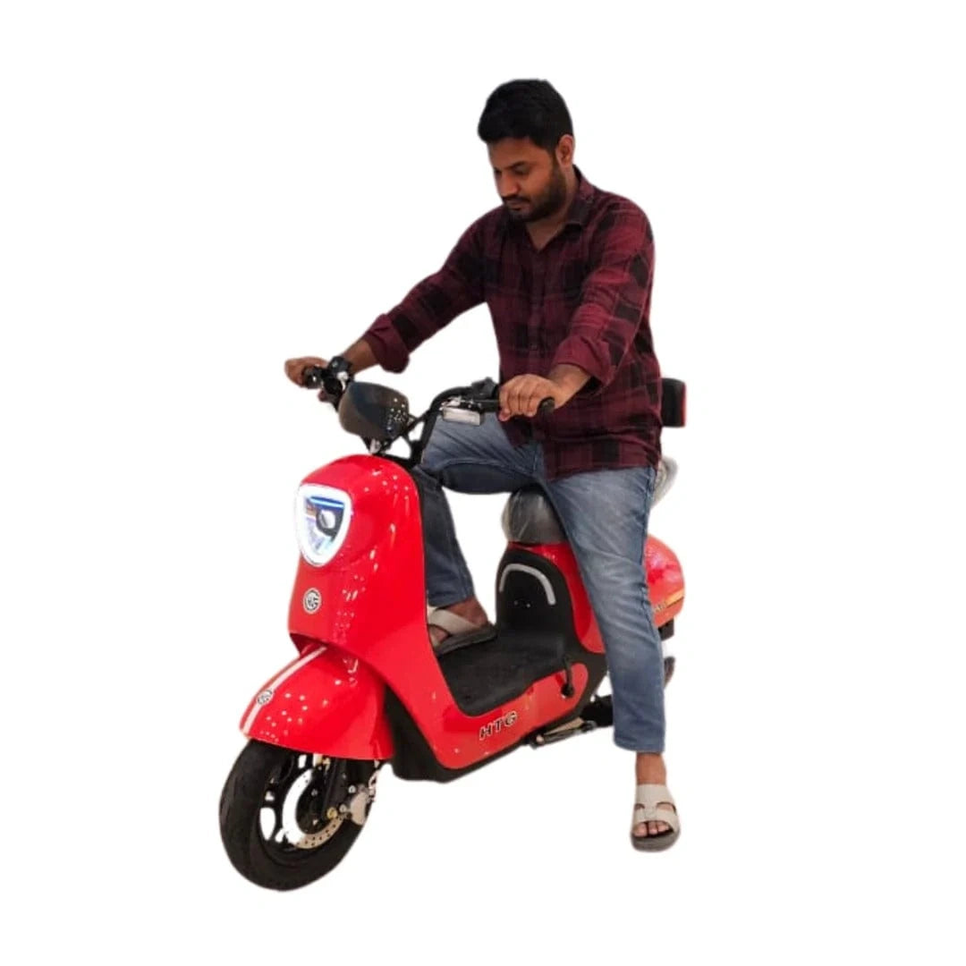 Man riding a red electric scooter on a white background