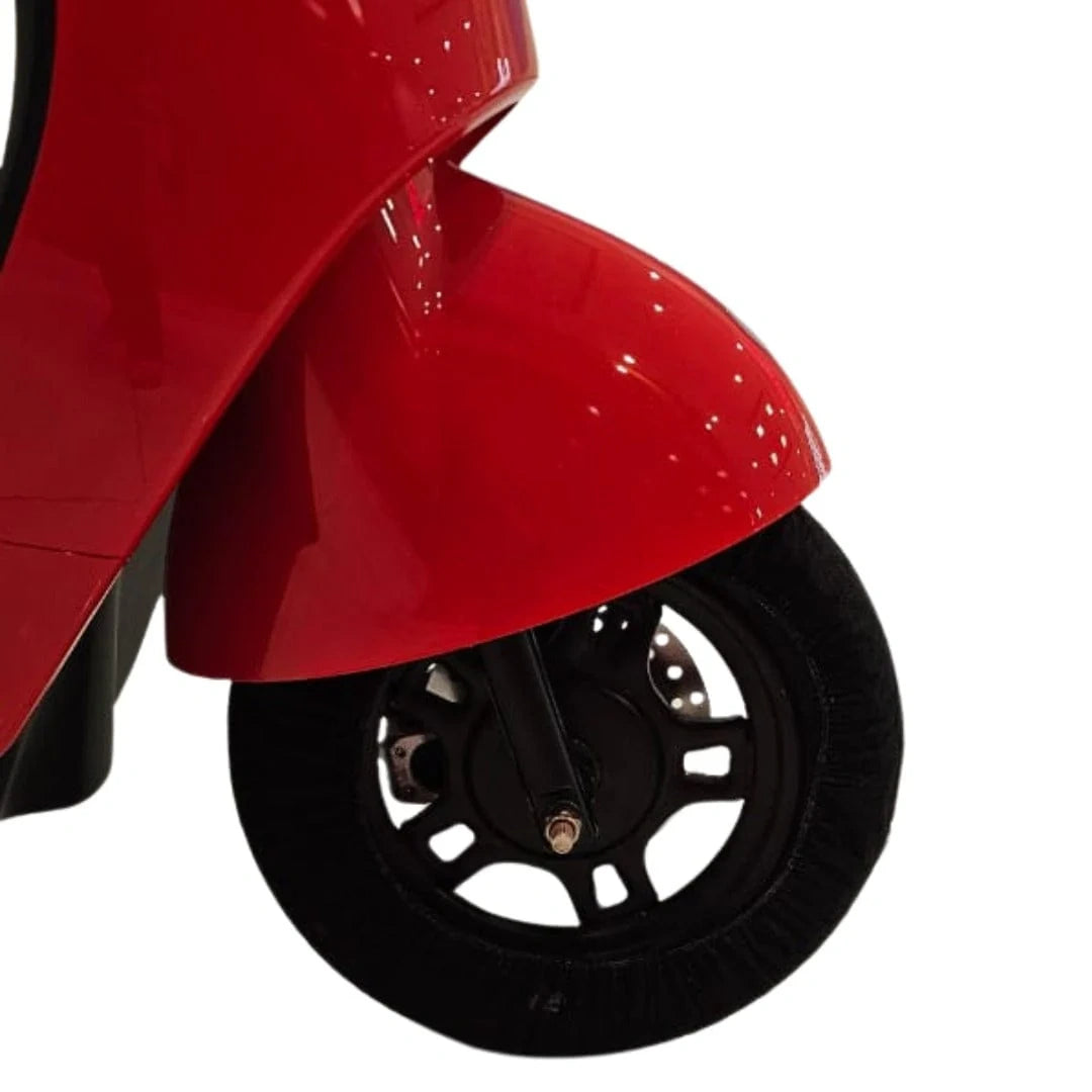Close-up of a red scooter wheel on a white background