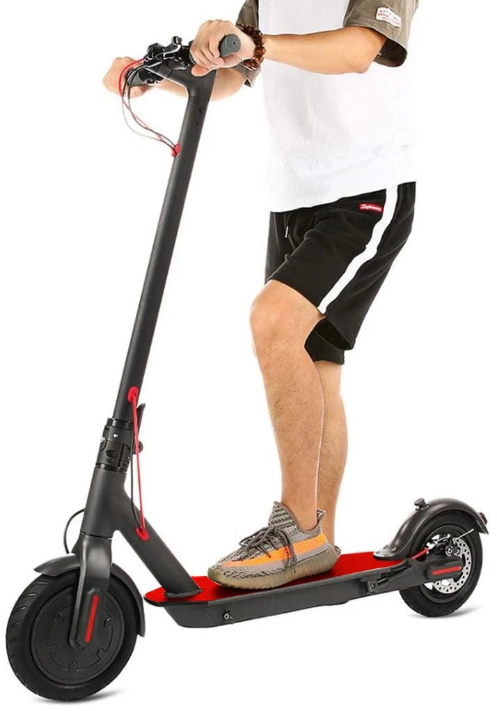 Person riding a black electric scooter on a white background