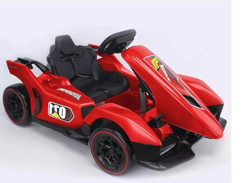Red toy car with black seats on a white background