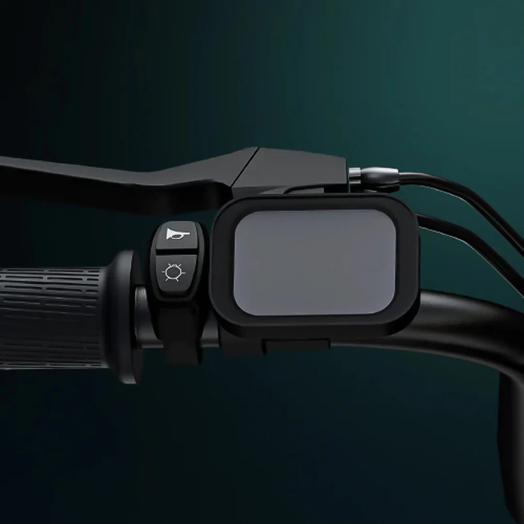 Motorcycle handlebar with control panel and mirror on a dark background