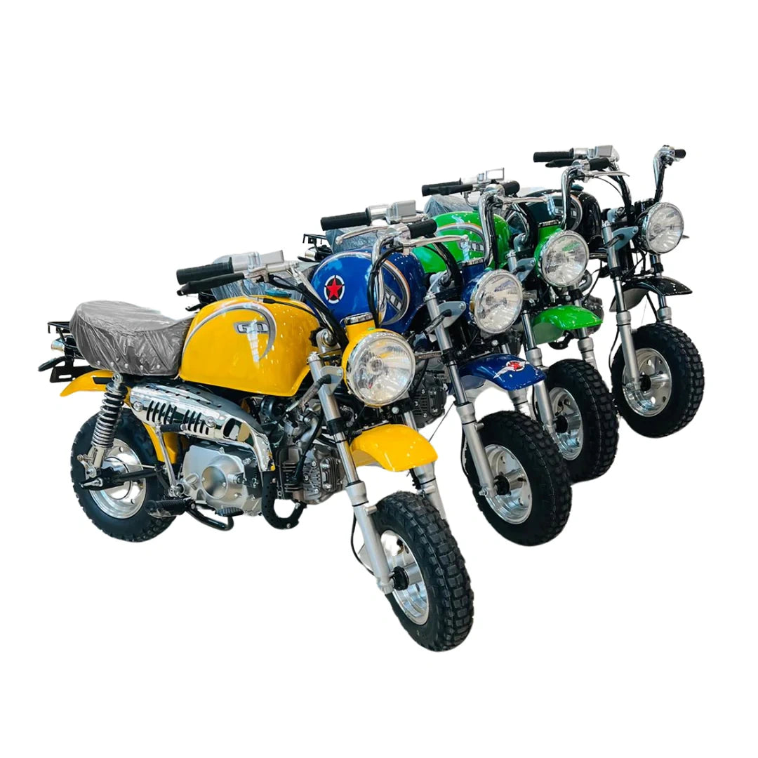Four toy motorcycles in different colors on a white background