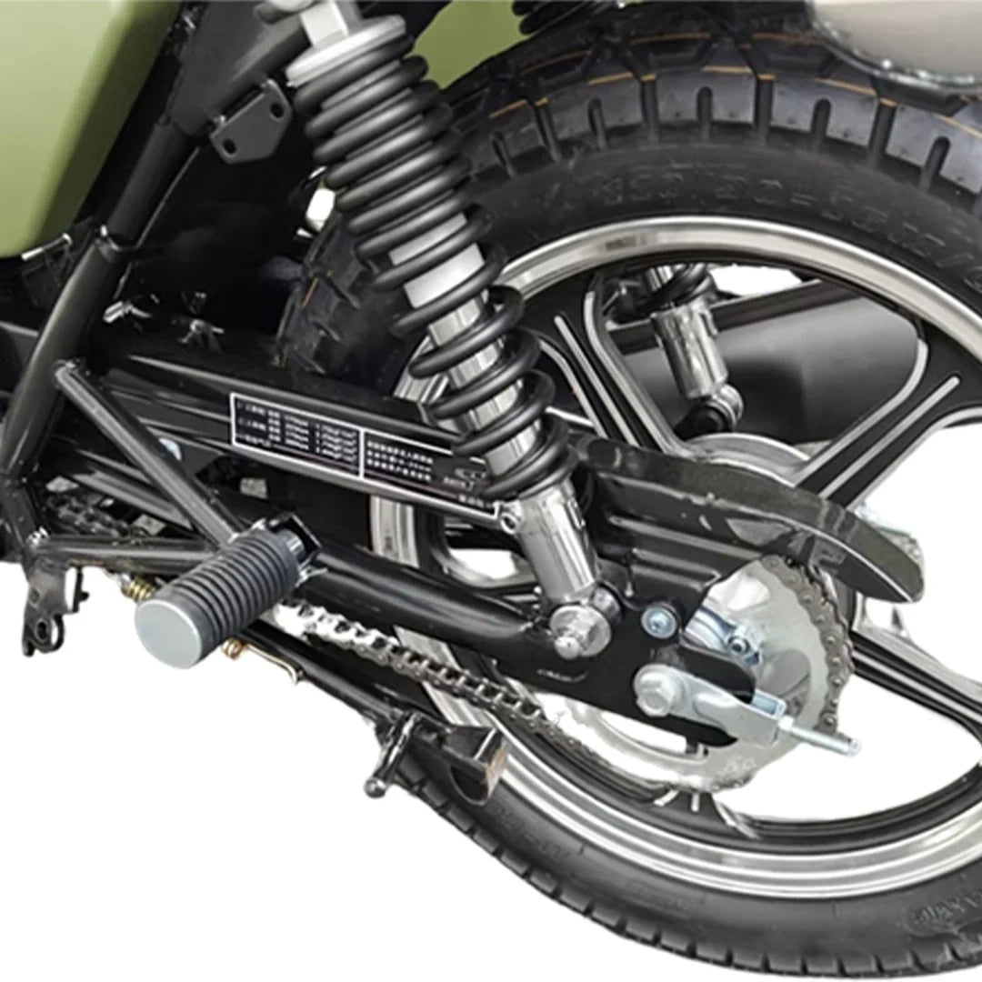 Close-up of a motorcycle's suspension system on a white background