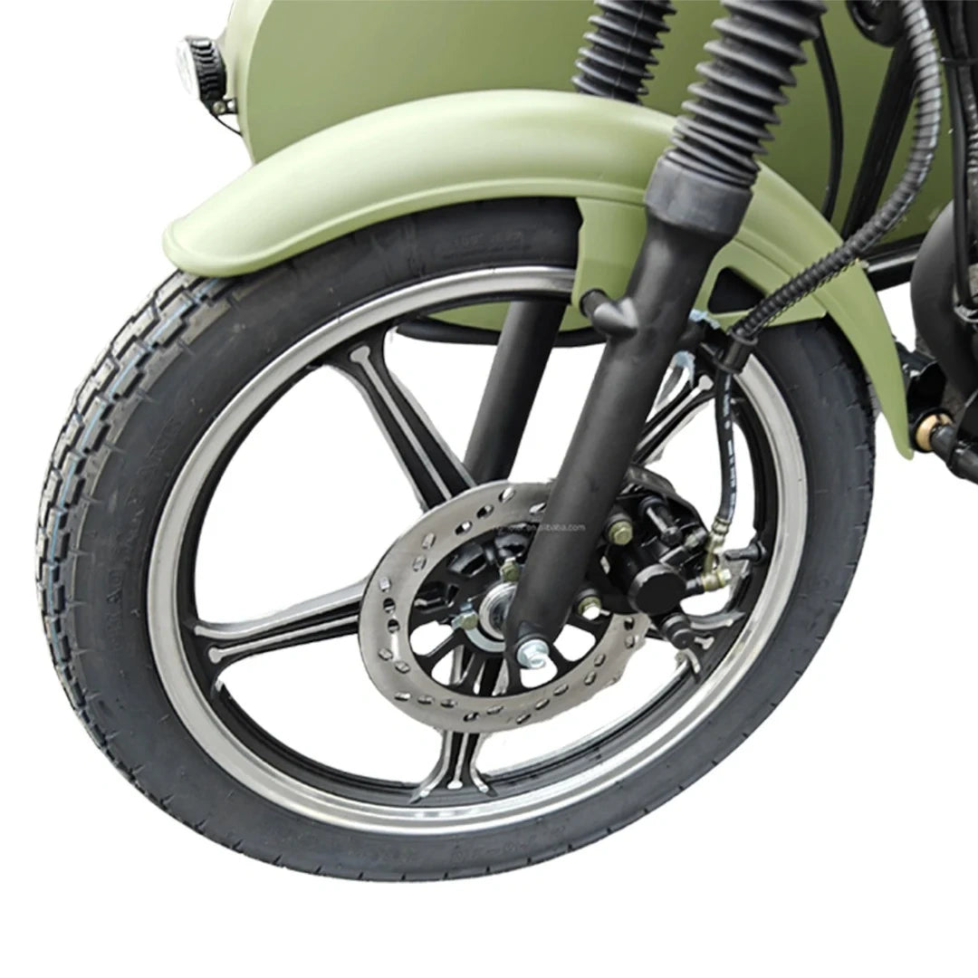 Close-up of a motorcycle wheel with suspension and disc brake on a white background