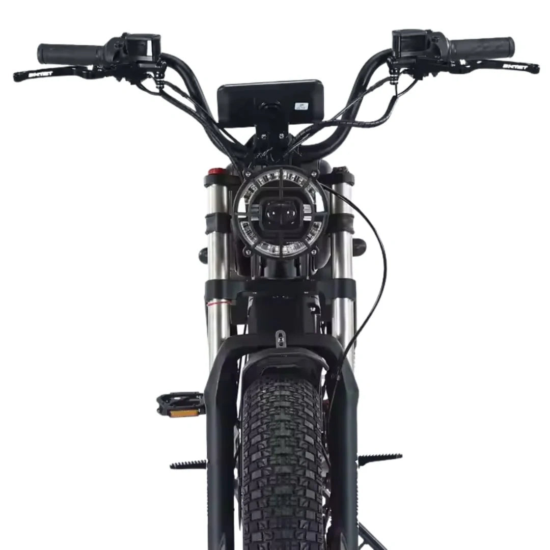 Close-up of a black electric bike with handlebars and front wheel on a white background