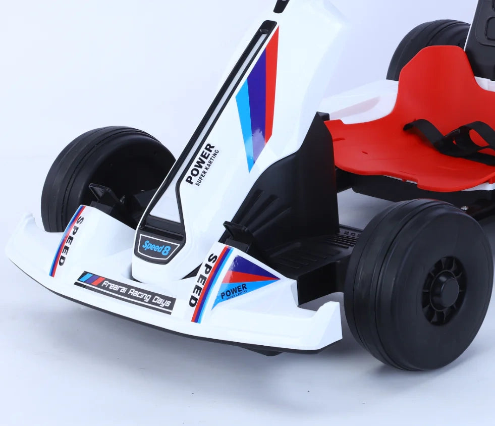 Children's go-kart with red seat and white body on a light gray background