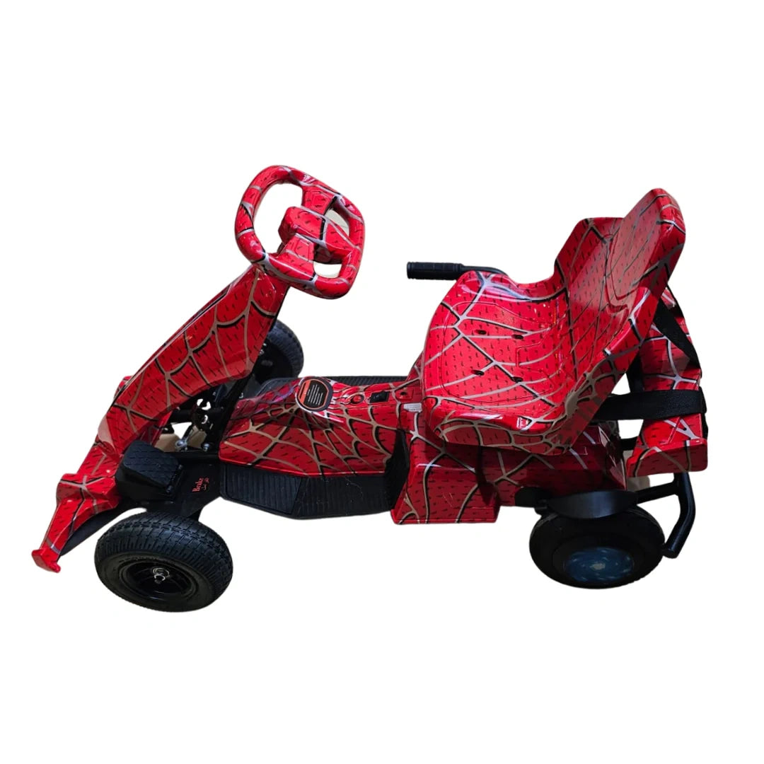 Red toy scooter with spider web design on a white background