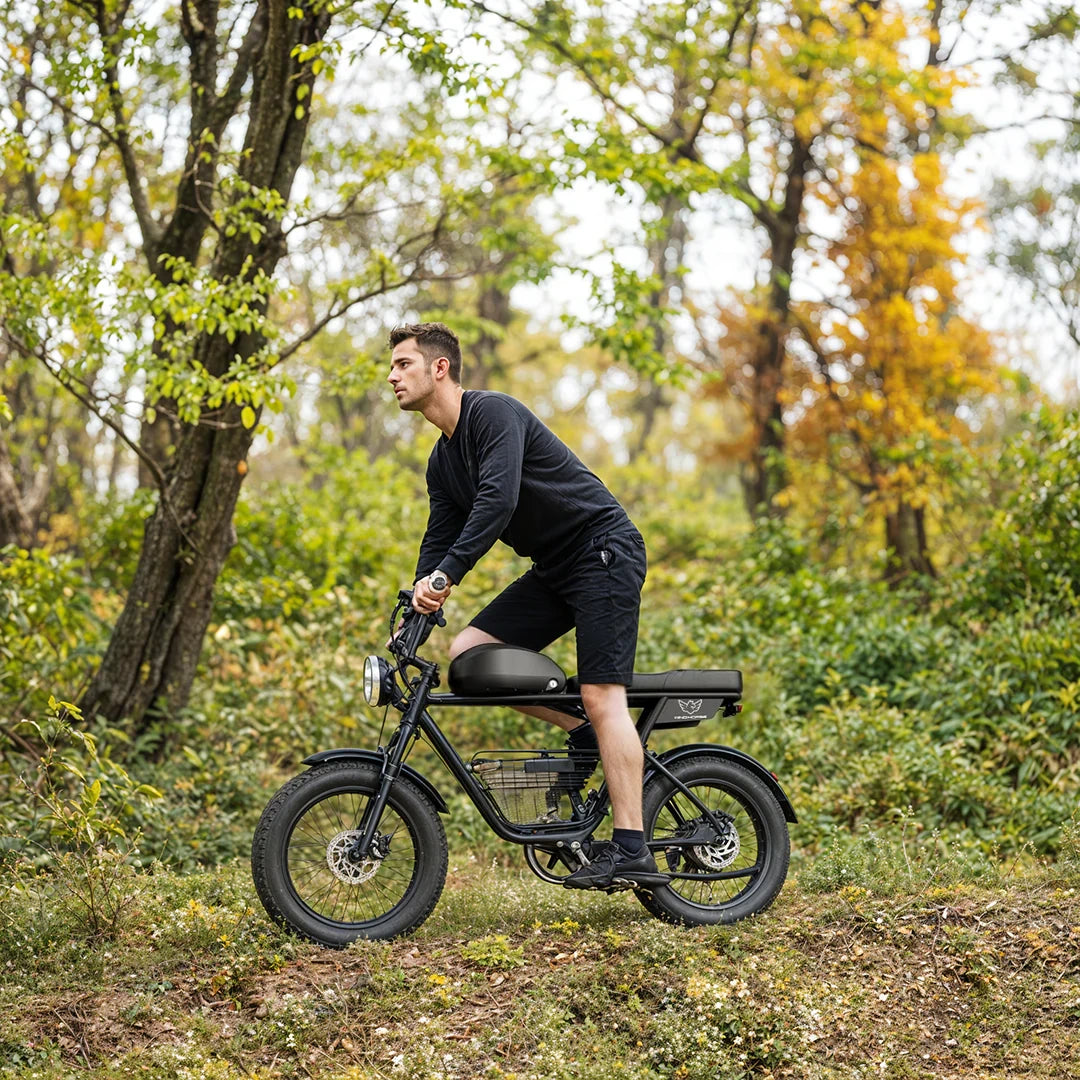 Man riding an electric bike through a forest