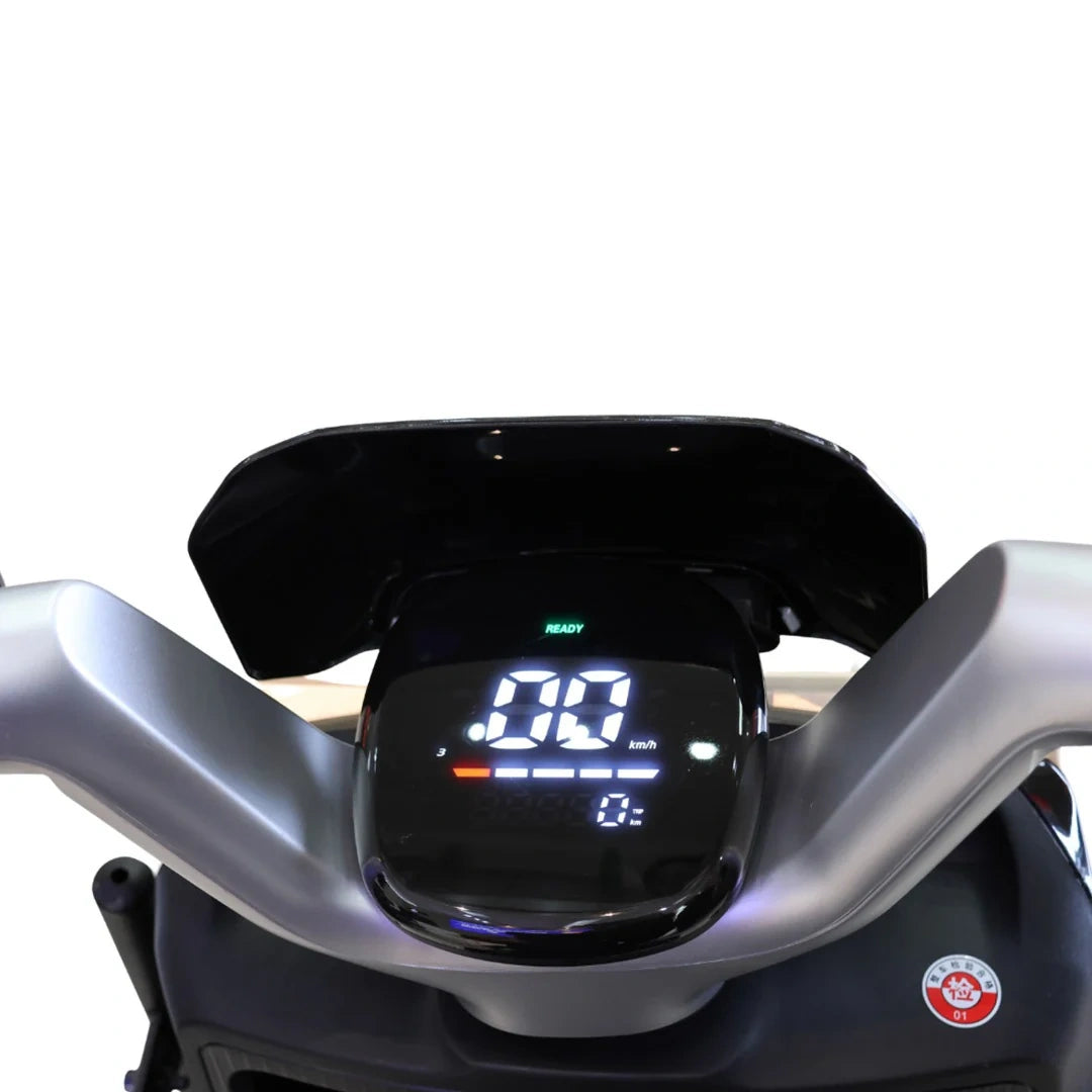 Close-up of a motorcycle dashboard with digital display on a white background