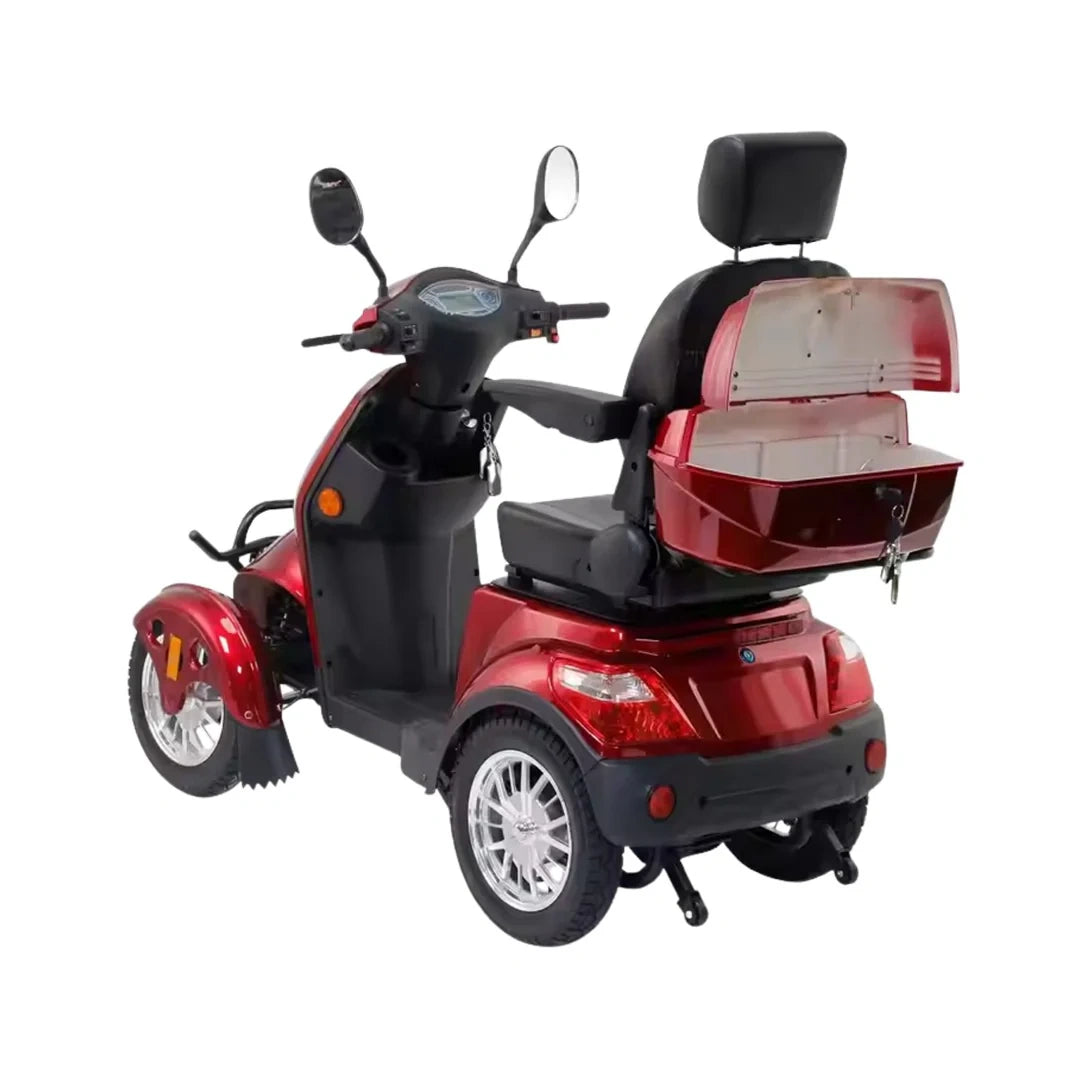Red and black three-wheeled mobility scooter with storage compartment on a white background