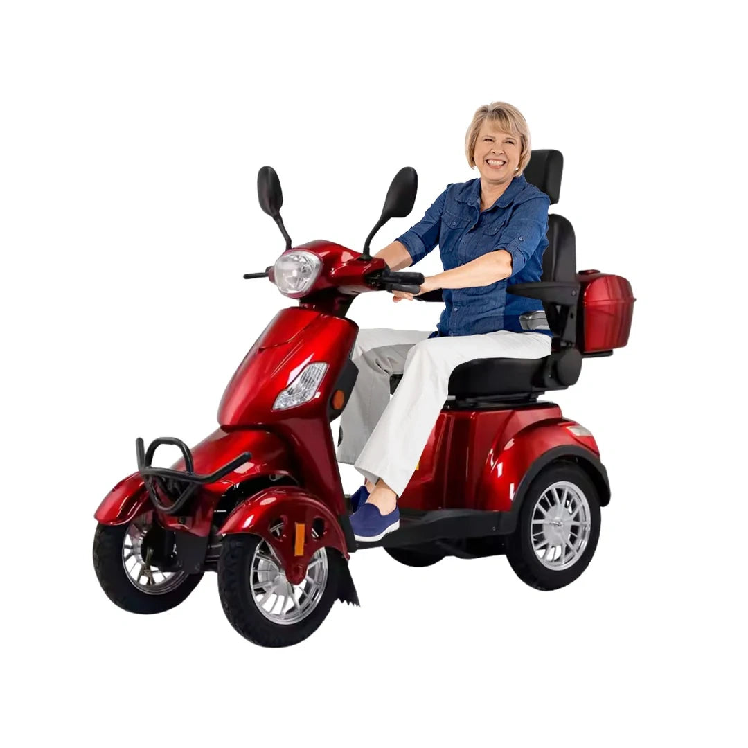 Woman sitting on a red mobility scooter against a white background