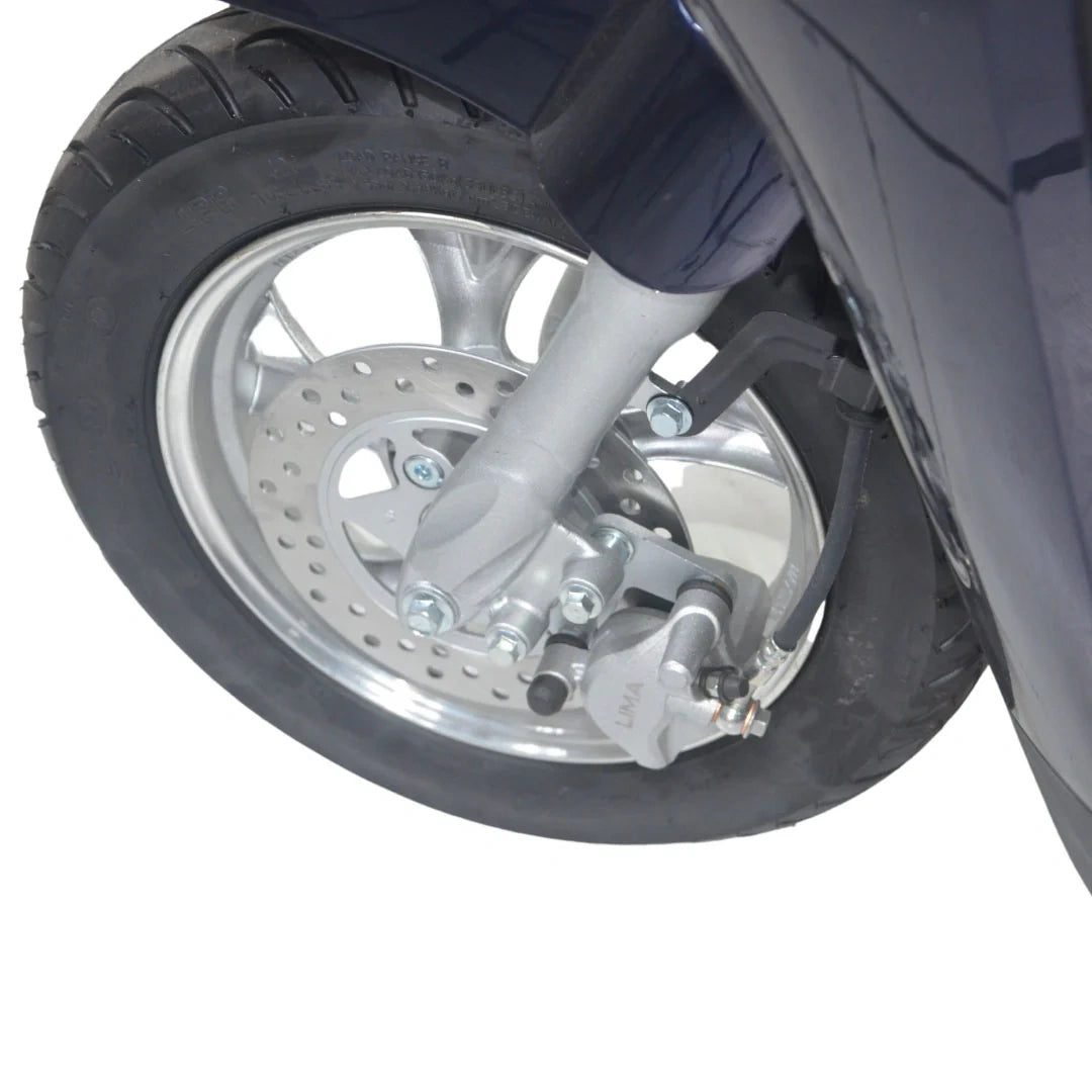 Close-up of a motorcycle wheel with suspension and tire on a white background
