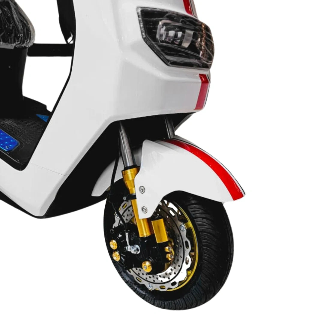 Close-up of a scooter's front wheel and headlight on a white background