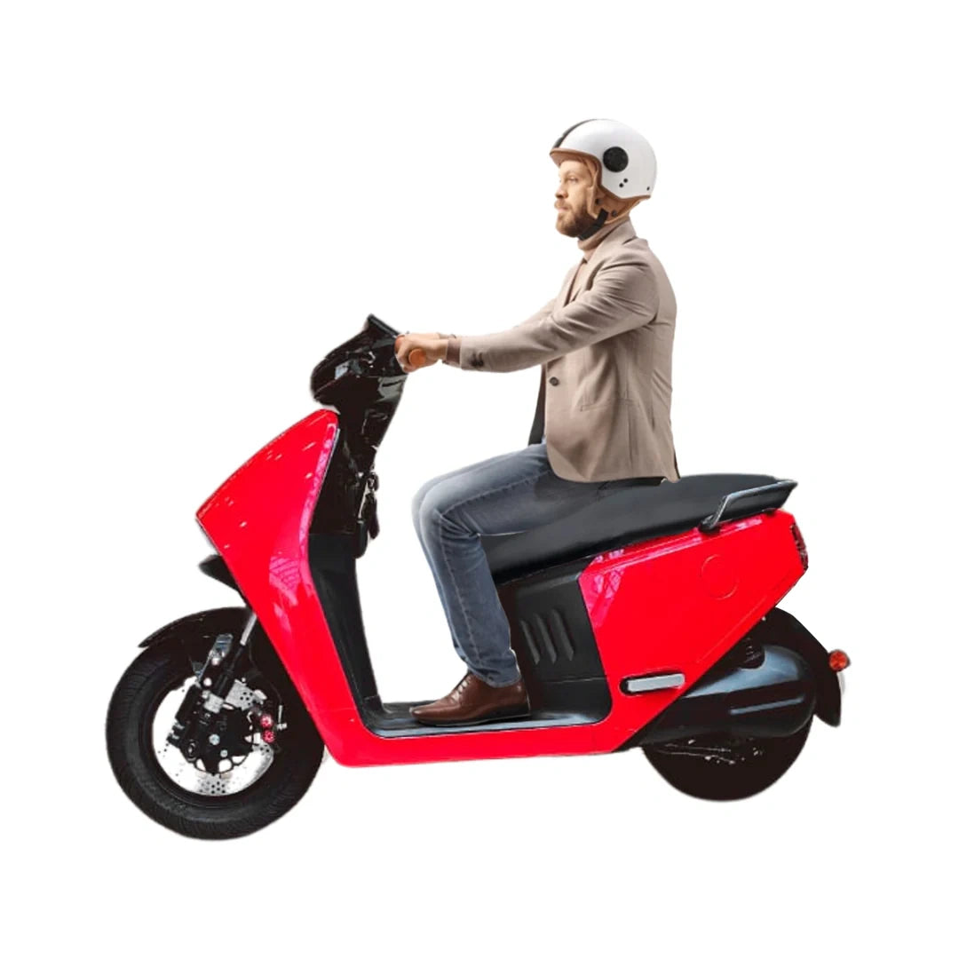 Man sitting on a red scooter with a white background