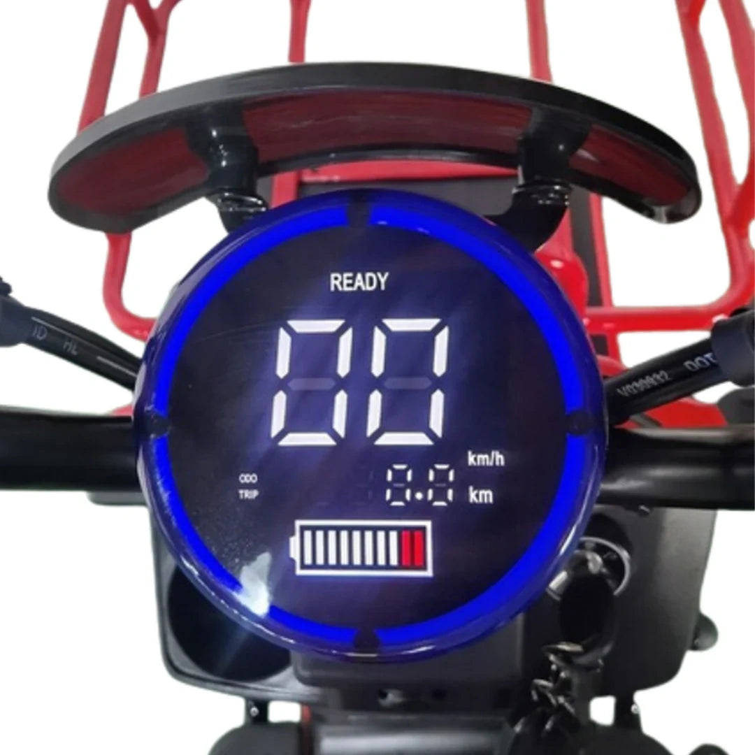 Digital speedometer with blue display on a motorcycle, showing speed and other metrics.