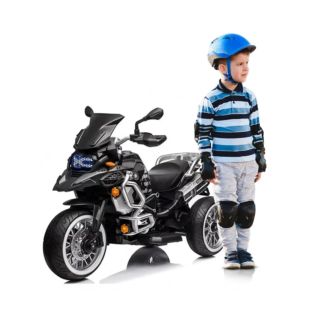 Child with a toy motorcycle on a white background