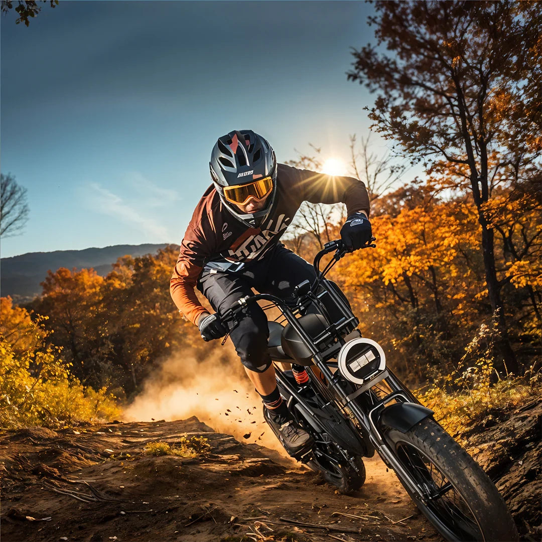 Person riding a motorcycle on a dirt trail with autumn foliage and sunflare.