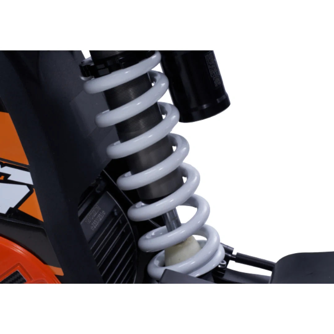 Close-up of a motorcycle suspension system with visible KTM branding.