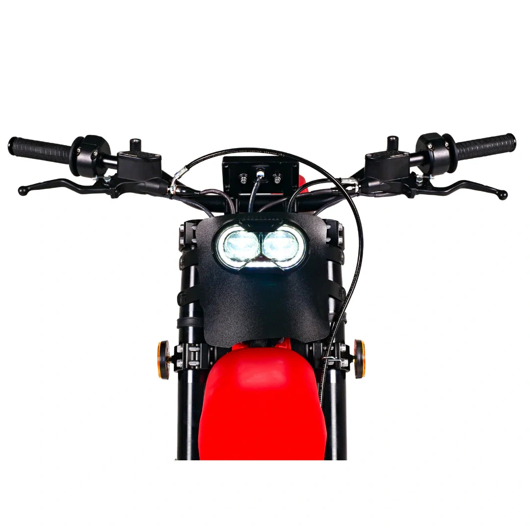 Close-up of a motorcycle handlebar with red front fender on a white background