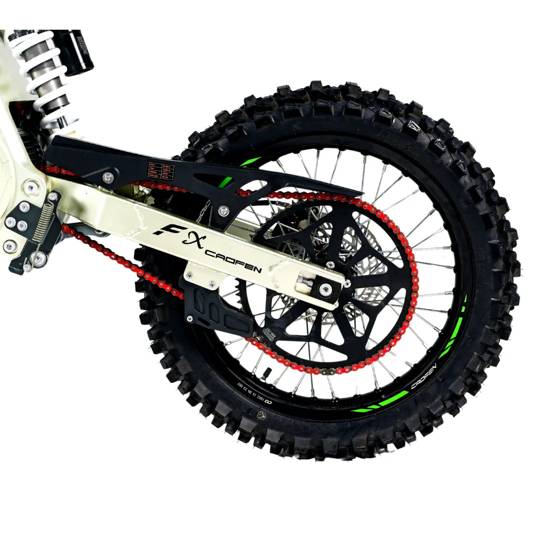 Close-up of a dirt bike wheel with FX Racing branding on a white background